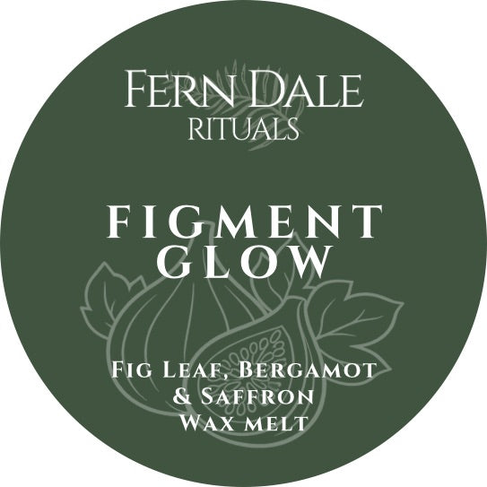 Figment Glow circular dark green wax melt label with white lettering and a line drawing of figs and leaves.