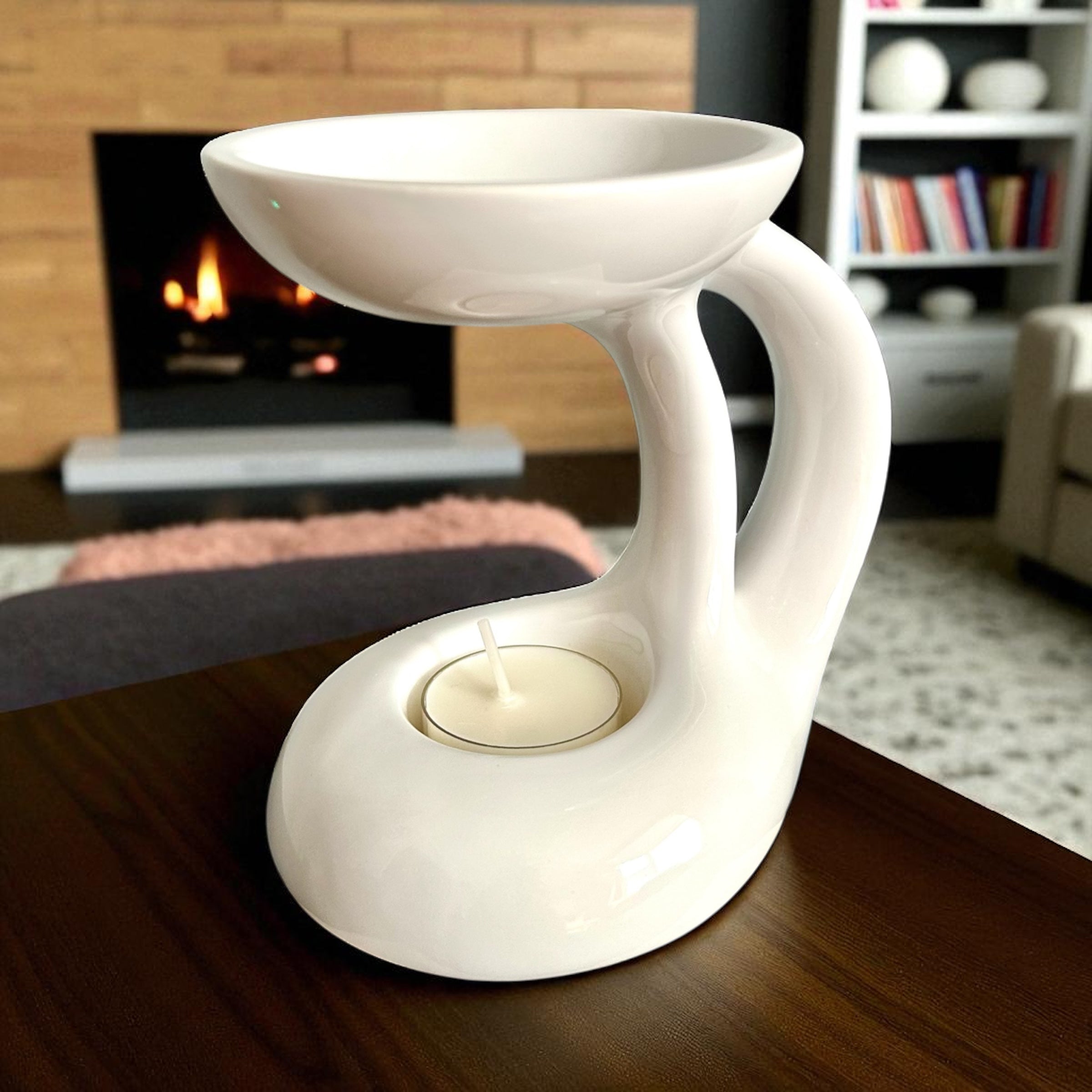 Lunar Arc Wax Burner — Gloss White Ceramic with a curved open frame, shallow dish and unlit tealight on a wooden table.