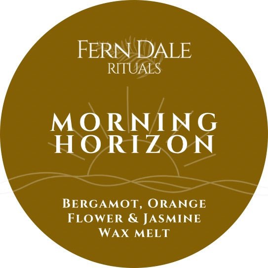 Morning Horizon round ochre label with white lettering and a gold line drawing of a sunrise over waves.