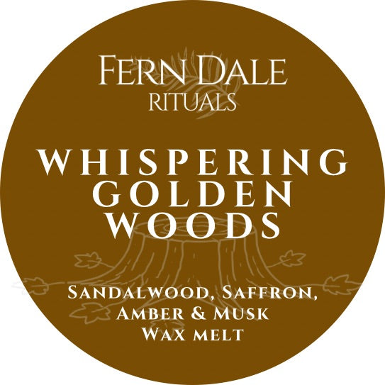 Whispering Golden Woods circular brown wax melt label with cream lettering and a faint tree stump illustration.